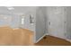 Sunlit living room boasts stylish flooring and neutral paint at 208 Hardwood Ridge Ct, Clayton, NC 27520