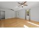Large living room with hardwood floors, ceiling fans, and natural light at 208 Hardwood Ridge Ct, Clayton, NC 27520