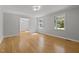 Sun-filled living room highlighting modern lighting and neutral decor at 208 Hardwood Ridge Ct, Clayton, NC 27520