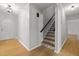 Bright hallway showcasing staircase featuring decorative tile risers at 208 Hardwood Ridge Ct, Clayton, NC 27520