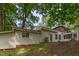 Back of home surrounded by mature trees and greenery, great backyard space at 214 Woodcrest Ave, Smithfield, NC 27577