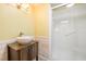 Stylish bathroom with vessel sink, wood-like vanity, and modern shower at 214 Woodcrest Ave, Smithfield, NC 27577
