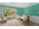 Inviting dining area with a large window, carpet, and seating for four at 214 Woodcrest Ave, Smithfield, NC 27577