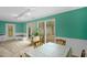 Bright dining area featuring a table for four, built-in bench, and large windows at 214 Woodcrest Ave, Smithfield, NC 27577