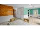 Comfortable dining area with wood paneling and neutral carpet at 214 Woodcrest Ave, Smithfield, NC 27577