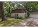 Traditional home with well-maintained landscaping, complemented by mature trees at 214 Woodcrest Ave, Smithfield, NC 27577