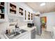 Well-lit kitchen with stainless steel appliances, double sink, and ample storage at 214 Woodcrest Ave, Smithfield, NC 27577