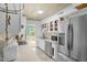 Bright kitchen with white cabinets, stainless steel appliances, and light countertop at 214 Woodcrest Ave, Smithfield, NC 27577