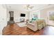 Inviting living room with hardwood floors, natural light, and a view to the deck at 214 Woodcrest Ave, Smithfield, NC 27577