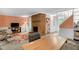 Inviting living room featuring a brick fireplace, a plush chair, and natural light at 214 Woodcrest Ave, Smithfield, NC 27577