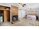 Cozy main bedroom with brick fireplace, ceiling fans, and large closet at 214 Woodcrest Ave, Smithfield, NC 27577