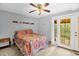 Main bedroom with ceiling fan and outdoor access at 214 Woodcrest Ave, Smithfield, NC 27577