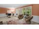 Comfortable office area with modern furniture and natural light with access to the screened porch at 214 Woodcrest Ave, Smithfield, NC 27577