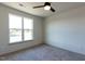 Empty bedroom featuring a large window overlooking the neighborhood, providing potential for customization and design at 2300 Gathering Sq Ct, Fuquay Varina, NC 27526