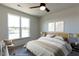 Virtually staged bedroom with a large window, providing natural light and an outdoor view to the neighborhood at 2300 Gathering Sq Ct, Fuquay Varina, NC 27526