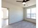Bedroom with carpet flooring, complemented by a large window, creating a serene and inviting space at 2300 Gathering Sq Ct, Fuquay Varina, NC 27526
