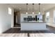 Modern kitchen boasts granite countertops, stainless appliances, and white cabinetry at 2300 Gathering Sq Ct, Fuquay Varina, NC 27526