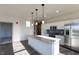 Modern kitchen boasts granite countertops, stainless appliances, and white cabinetry at 2300 Gathering Sq Ct, Fuquay Varina, NC 27526