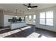 Bright living area featuring a kitchen island, modern appliances, and an open layout, providing style and functionality at 2300 Gathering Sq Ct, Fuquay Varina, NC 27526