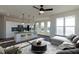 Virtually staged living space with a kitchen island, modern appliances, and an open layout for entertaining at 2300 Gathering Sq Ct, Fuquay Varina, NC 27526