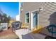 Inviting outdoor patio area with chairs, grill, and direct access to the home at 2440 Tonoloway Dr, Raleigh, NC 27610