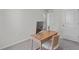 Cozy bedroom setup with a wooden desk, comfortable chair, and stylish decor at 2440 Tonoloway Dr, Raleigh, NC 27610