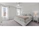 A well-lit bedroom featuring carpet, neutral colored walls, and a ceiling fan at 2440 Tonoloway Dr, Raleigh, NC 27610