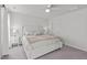 Spacious bedroom featuring a large bed, side tables, and plush carpet flooring at 2440 Tonoloway Dr, Raleigh, NC 27610