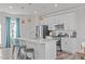 Modern kitchen with white cabinets, stainless appliances, and eat-in island at 2440 Tonoloway Dr, Raleigh, NC 27610