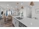 Bright kitchen with large island, stainless sink, and open floor plan to the living room at 2440 Tonoloway Dr, Raleigh, NC 27610