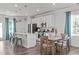 Modern kitchen with white cabinets, stainless appliances, and eat-in island at 2440 Tonoloway Dr, Raleigh, NC 27610