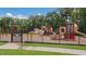 A colorful community playground features slides, climbing structures, and swings within a secure fenced area at 2440 Tonoloway Dr, Raleigh, NC 27610