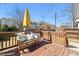 Cozy back deck with bench seating and string lights at 2715 Edmund St, Durham, NC 27705