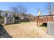 Backyard features a wood shed, wooden deck, and fenced yard at 2715 Edmund St, Durham, NC 27705
