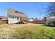 Backyard with a wooden deck, grass, and wood fence at 2715 Edmund St, Durham, NC 27705