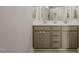 Bathroom featuring double sinks with white countertops, lots of storage space, and modern hardware at 2715 Edmund St, Durham, NC 27705