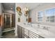 Bright bathroom with double vanity, a glass enclosed shower, and lots of natural light at 2715 Edmund St, Durham, NC 27705