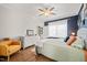 Comfortable bedroom with blue accent wall, hardwood floors, and natural light at 2715 Edmund St, Durham, NC 27705