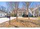 Home with a welcoming front porch, shingle detailing, a bright yellow front door and a mailbox with the house number at 2715 Edmund St, Durham, NC 27705