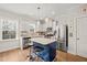 Modern kitchen with stainless steel appliances, a kitchen island, and stylish pendant lighting at 2715 Edmund St, Durham, NC 27705