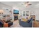 Inviting living room with a fireplace, large windows, and comfortable seating at 2715 Edmund St, Durham, NC 27705
