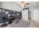 Comfortable office space with an accent wall, ceiling fan, and large windows at 2715 Edmund St, Durham, NC 27705