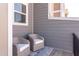 Cozy balcony with two wicker chairs and a blue patterned rug, perfect for relaxing outdoors at 2929 Great Lawn Rd, Apex, NC 27502