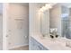 Bathroom featuring double vanity, ample lighting, and neutral finishes at 2929 Great Lawn Rd, Apex, NC 27502