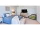 Comfortable bedroom with a cozy bed, dresser, and chair, ideal for relaxation and rest in a peaceful environment at 2929 Great Lawn Rd, Apex, NC 27502