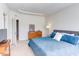 Bright bedroom with a dresser, carpet flooring, and a doorway at 2929 Great Lawn Rd, Apex, NC 27502