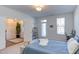 Serene bedroom with a view, a workspace, and ample natural light, creating an inviting and functional living space at 2929 Great Lawn Rd, Apex, NC 27502