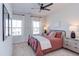 Well-lit bedroom with cozy decor and a large window at 2929 Great Lawn Rd, Apex, NC 27502