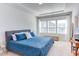 Bright bedroom with tray ceilings and ample natural light from large windows at 2929 Great Lawn Rd, Apex, NC 27502