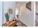 Inviting hallway featuring stylish decor and wood-look flooring leading to other rooms at 2929 Great Lawn Rd, Apex, NC 27502